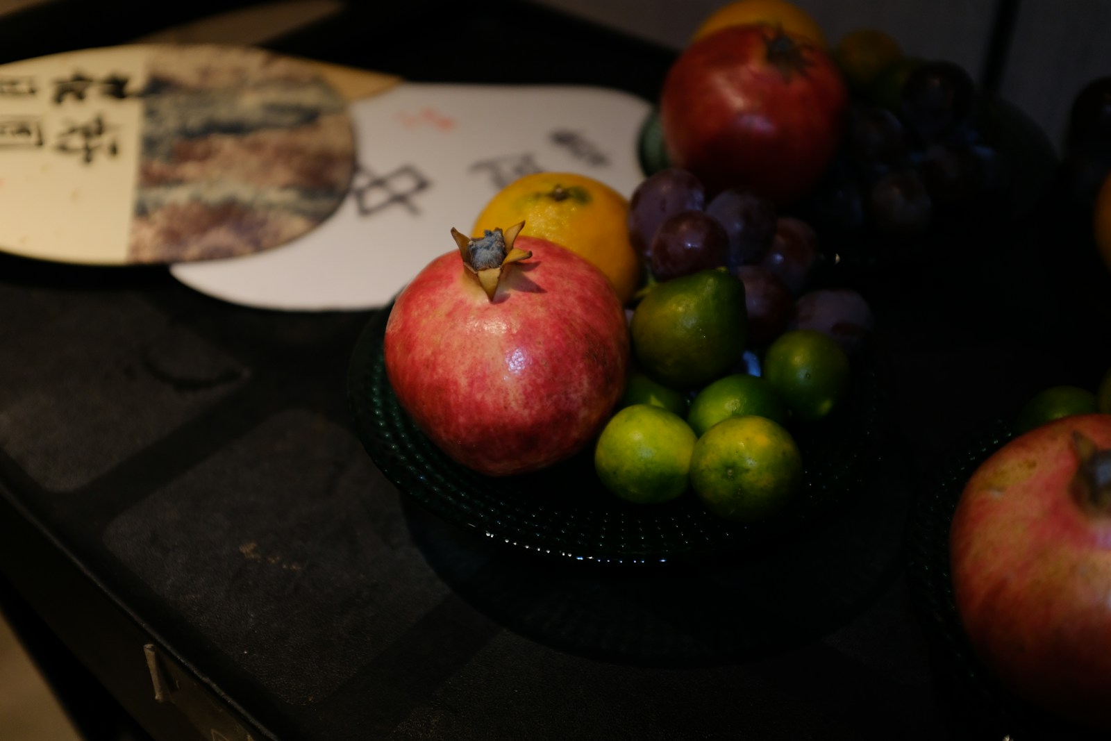 a bowl of fruit sitting on top of a table